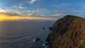 Sunset over the Atlantic Ocean and the cliffs of Bray Head on Valentia Island in County Kerry Royalty Free Stock Photo