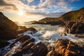 Sunset over the Atlantic Ocean in Cornwall, England, United Kingdom, A Rocky Beach landscape view with rough sea waves and