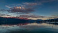Sunset over the Attersee lake with dramatic clouds and mountains in the background in NuÃÅ¸dorf, near Salzburg Royalty Free Stock Photo