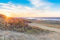 Sunset over autumn leaves on a hillside overlooking Lake Diefenbaker Royalty Free Stock Photo