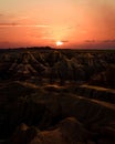 Sunset over badlands. A terrain with striped rock formations