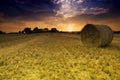 Sunset over bails of hay Royalty Free Stock Photo
