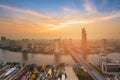 Sunset over Bangkok city downtown with river curved aerial view