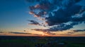 Sunset over barns and silos during the golden hour