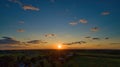 Sunset over barns and silos