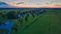 Sunset over barns and silos