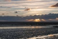 Sunset across the beach Royalty Free Stock Photo