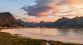 Sunset over a beach in Lofoten, in the summer, high mountains and beautiful clouds Royalty Free Stock Photo