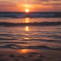 Sunset over the beach, ocean waves crashing as the sun sets Royalty Free Stock Photo