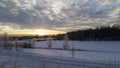 Sunset over beautiful snow covered field Royalty Free Stock Photo