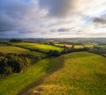 Sunset over Berry Pomeroy Village and Meadows in Devon, England Royalty Free Stock Photo