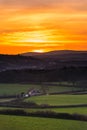 Sunset over Berry Pomeroy Village and Meadows in Devon, England Royalty Free Stock Photo