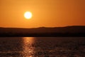 Sunset over the Birket Siwa salt-water lake, in the Siwa oasis, Egypt Royalty Free Stock Photo