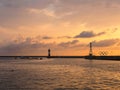 sunset over the Black Sea. View of the lighthouse and Olympic rings in Sochi Royalty Free Stock Photo