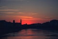 Sunset over black silhouette of Pisa cityline and Aron river Royalty Free Stock Photo