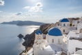 Sunset over blue domed churches on the Caldera at Oia on the Greek Island of Santorini. Royalty Free Stock Photo