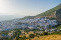 Sunset over the blue Moroccan town of Chefchaouen, as seen from the hill of the Spanish Mosque. Royalty Free Stock Photo