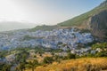 Sunset over the blue Moroccan town of Chefchaouen, as seen from the hill of the Spanish Mosque. Royalty Free Stock Photo