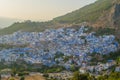 Sunset over the blue Moroccan town of Chefchaouen, as seen from the hill of the Spanish Mosque. Royalty Free Stock Photo