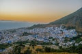 Sunset over the blue Moroccan town of Chefchaouen, as seen from the hill of the Spanish Mosque. Royalty Free Stock Photo