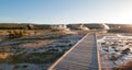 Sunset over boardwalk at the Old Faithful geyser basin in Yellowstone National Park in Wyoming USA Royalty Free Stock Photo