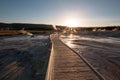 Sunset over boardwalk at the Old Faithful geyser basin in Yellowstone National Park in Wyoming USA Royalty Free Stock Photo