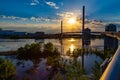 Sunset over Bob Kerrey Pedestrian bridge and swollen Missouri River at Omaha Riverfront Royalty Free Stock Photo