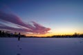 A sunset over a body of frozen water Royalty Free Stock Photo