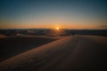 Sunset over a calm desert landscape