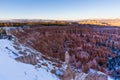 Sunset over canyon slopes covered in snow, Bryce Canyon National Royalty Free Stock Photo