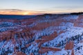 Sunset over canyon slopes covered in snow, Bryce Canyon National Royalty Free Stock Photo