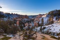 Sunset over canyon slopes covered in snow, Bryce Canyon National Royalty Free Stock Photo