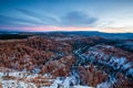 Sunset over canyon slopes covered in snow, Bryce Canyon National Royalty Free Stock Photo