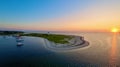 Sunset over Cape Cod coastline with lighthouse Royalty Free Stock Photo