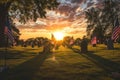 Sunset Over Cemetery With American Flags in Foreground, A beautiful sunset over a national cemetery with American flags at each Royalty Free Stock Photo