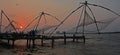 Sunset over Chinese fishing nets Royalty Free Stock Photo