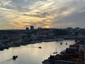 Sunset over the cities Porto and Vila Nova de Gaia and river Douro and the boats, Porto, Portugal, November 2022 Royalty Free Stock Photo