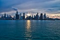 Sunset over the city of Chicago skyline with added interest in cloudscape and reflections. Royalty Free Stock Photo