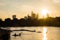 Sunset over the city of London with rowers in the foreground Royalty Free Stock Photo