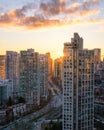 Sunset over a city skyline with a road winding between buildings. Pacific Blvd and False Creek in Vancouver Royalty Free Stock Photo