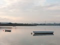 sunset over coast ocean bay water sky sea boats docks moored Royalty Free Stock Photo