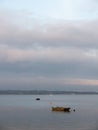 sunset over coast ocean bay water sky sea boats docks moored Royalty Free Stock Photo