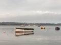 sunset over coast ocean bay water sky sea boats docks moored Royalty Free Stock Photo