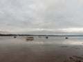 sunset over coast ocean bay water sky sea boats docks moored Royalty Free Stock Photo