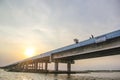 Sunset over concrete bridge on lake, Thale Noi, Phatthalung