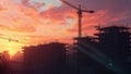 Sunset over construction site with cranes and vibrant clouds in the background Royalty Free Stock Photo