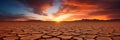 A sunset over a cracked desert somewhere on Earth, due to the lack of water and rising air temperatures caused by global Royalty Free Stock Photo