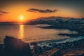 sunset over crete coastline with city skyline in the distance Royalty Free Stock Photo