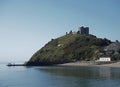 Sunset over Criccieth castle in North Wales in Gwynedde Royalty Free Stock Photo