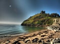 Sunset over Criccieth castle in North Wales in Gwynedde Royalty Free Stock Photo